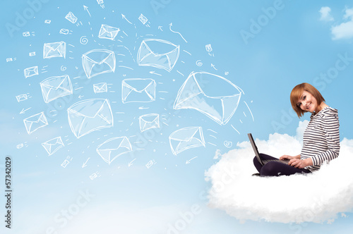 Photo: Young woman sitting in cloud with laptop Young woman sitting in cloud with laptop