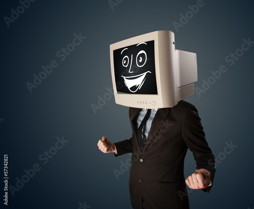 Photo: Happy businessman with a PC monitor head and a smiley face Happy businessman with a PC monitor head and a smiley face