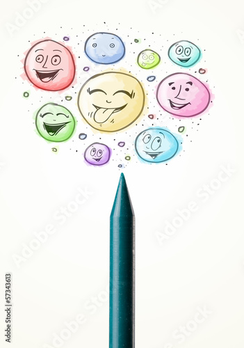 Photo: Smiley faces coming out of crayon Smiley faces coming out of crayon