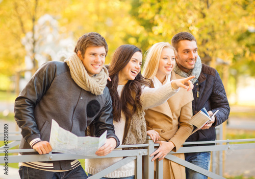 Photo: couples with tourist map in autumn park couples with tourist map in autumn park