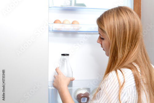 Photo: Girl in her kitchen Girl in her kitchen