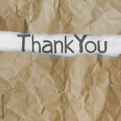 Photo: hand drawn thank you words on crumpled paper with tear envelope hand drawn thank you words on crumpled paper with tear envelope
