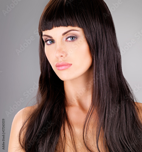 Photo: Portrait of a beautiful adult woman with long hair Portrait of a beautiful adult woman with long hair