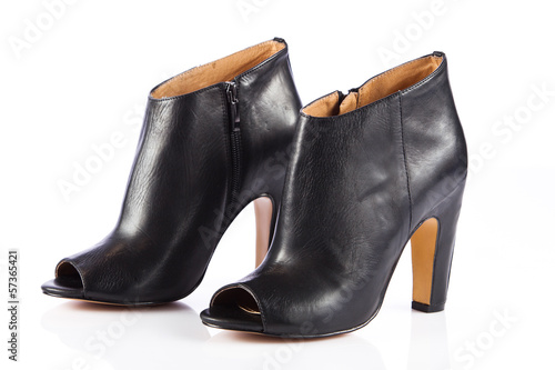 Photo: Woman shoes isolated on white. Nice woman shoes Woman shoes isolated on white. Nice woman shoes