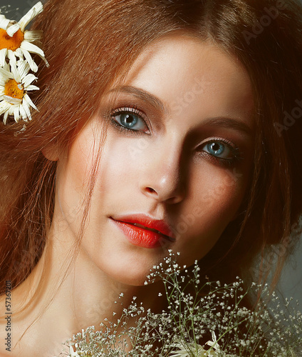 Photo: Freshness. Portrait of Romantic Redhead Woman with Chamomile Freshness. Portrait of Romantic Redhead Woman with Chamomile