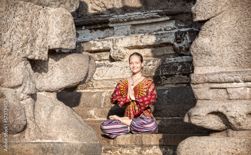 Photo: Woman doing yoga in India Woman doing yoga in India