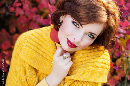 Photo: Pretty woman in autumn park Pretty woman in autumn park