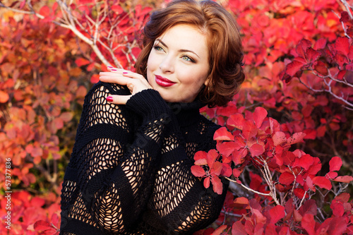 Photo: Pretty woman in autumn park Pretty woman in autumn park