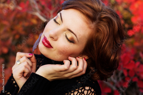 Photo: Pretty woman in autumn park Pretty woman in autumn park