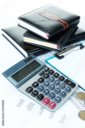 Photo: Office supplies with money and documents close up Office supplies with money and documents close up