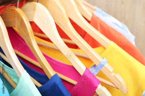 Photo: Clothes on circle hanger on light background Clothes on circle hanger on light background