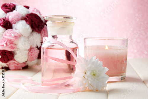 Photo: Glass bottle with color essence, on pink background Glass bottle with color essence, on pink background