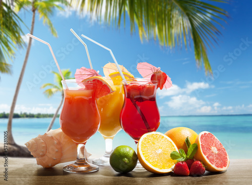 Photo: cocktails and tropical fruit on the beach cocktails and tropical fruit on the beach