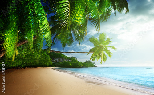 Photo: sunset on beach Anse Takamaka of Mahe island, seychelles sunset on beach Anse Takamaka of Mahe island, seychelles