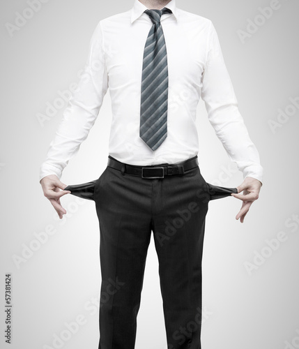 Photo: businessman with pockets turned inside out businessman with pockets turned inside out