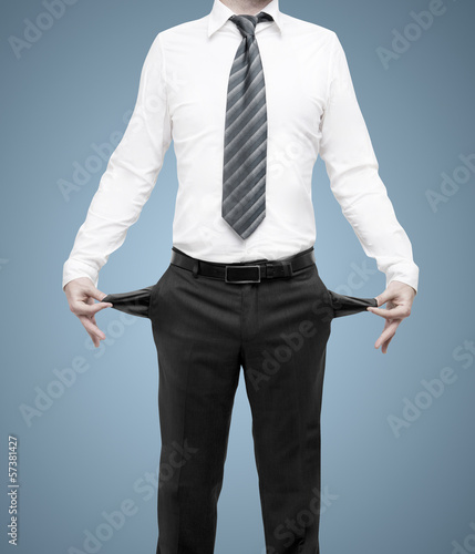 Photo: businessman with pockets turned inside out businessman with pockets turned inside out