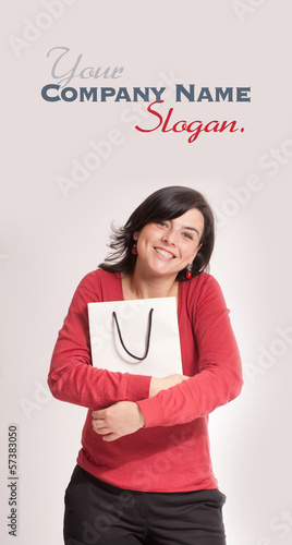 Photo: Happy brunette with shopping bag Happy brunette with shopping bag