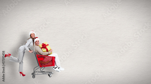 Photo: Running people with shopping cart Running people with shopping cart