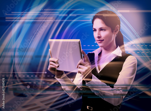 Photo: Young woman with tablet computer. Young woman with tablet computer.
