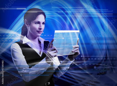 Photo: Young woman with tablet computer. Young woman with tablet computer.