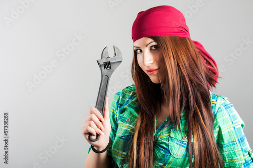 Photo: sexy girl holding adjustable wrench sexy girl holding adjustable wrench