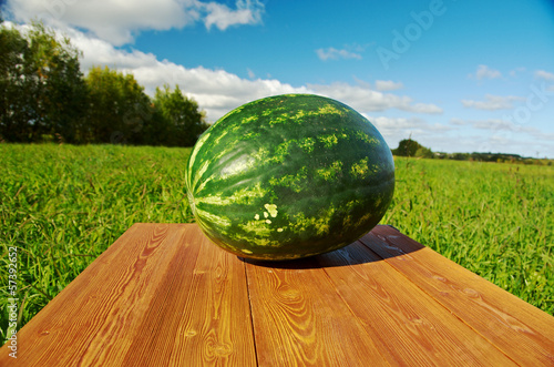 Photo: Watermelon on a wooden table Watermelon on a wooden table
