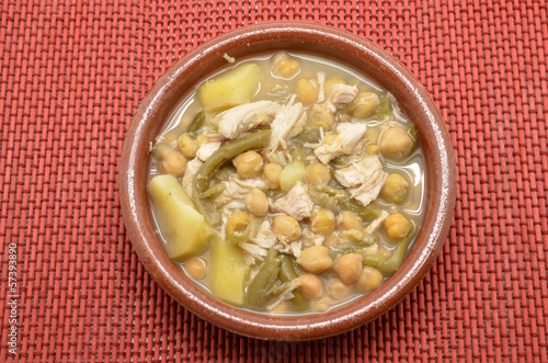 Photo: clay dish of stewed chickpeas with meat, beans and potatoes clay dish of stewed chickpeas with meat, beans and potatoes