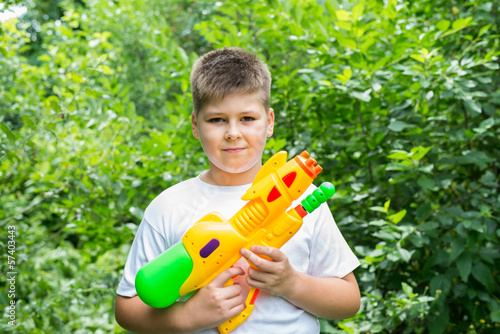 Photo: Boy with water pistol Boy with water pistol