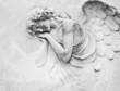 sleeping angel - antique decoration on tomb sleeping angel - antique decoration on tomb