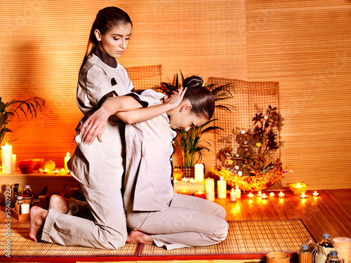 Photo: Therapist giving stretching massage to woman. Therapist giving stretching massage to woman.