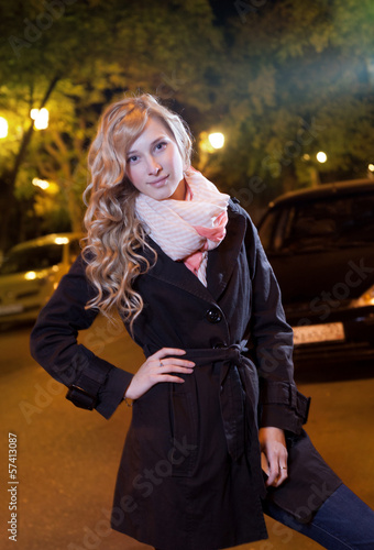 Photo: Young blond woman walking on the street Young blond woman walking on the street