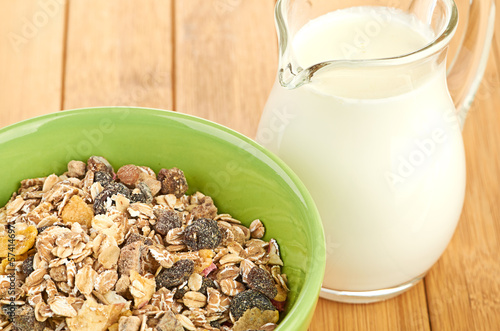 Photo: Delicious and healthy cereal in bowl with milk Delicious and healthy cereal in bowl with milk