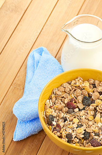 Photo: Delicious and healthy cereal in bowl with milk Delicious and healthy cereal in bowl with milk
