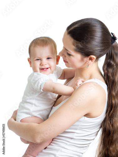 Photo: beautiful mother holding baby girl isolated on white beautiful mother holding baby girl isolated on white