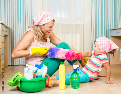 Photo: mother with kid cleaning room and having fun mother with kid cleaning room and having fun