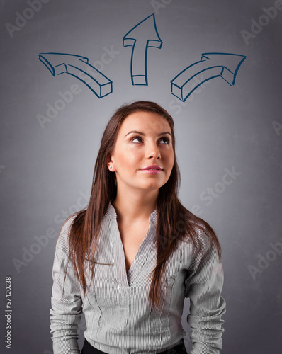 Photo: Pretty lady thinking with arrows overhead Pretty lady thinking with arrows overhead