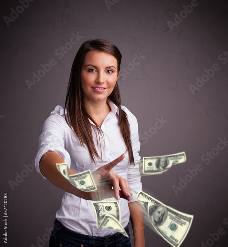 Photo: Young girl throwing money Young girl throwing money