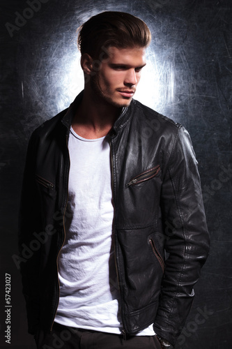 Photo: smiling fashion man wearing a leather jacket smiling fashion man wearing a leather jacket