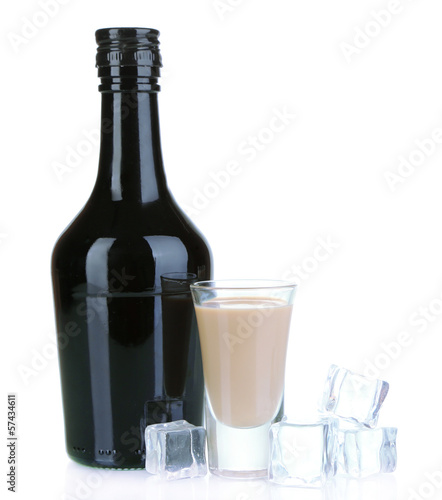 Photo: Baileys liqueur in bottle and glass isolated on white Baileys liqueur in bottle and glass isolated on white