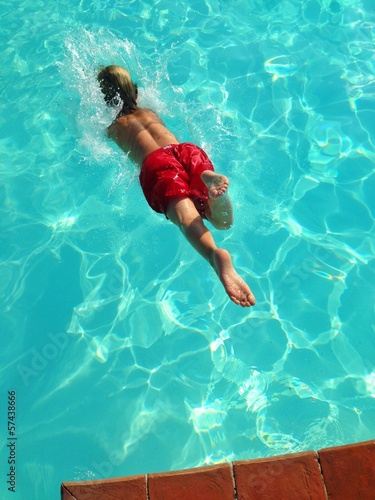 Instant Collection: young boy diving in pool young boy diving in pool