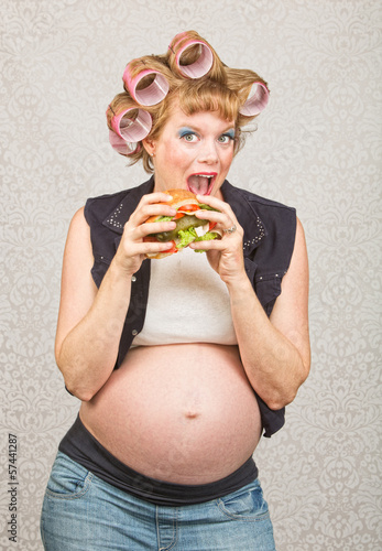 Photo: Pregnant Woman Eating a Sandwich Pregnant Woman Eating a Sandwich