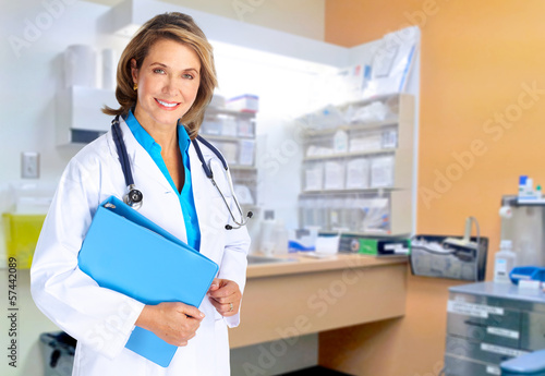 Photo: Smiling medical doctor woman and family. Smiling medical doctor woman and family.
