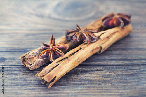 Photo: Star anise and cinnamon on a wooden background Star anise and cinnamon on a wooden background