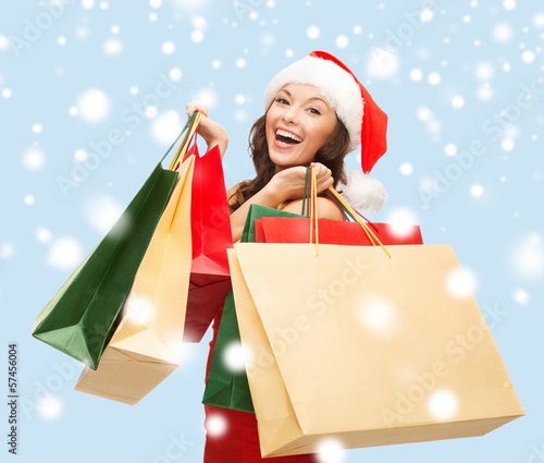 Photo: woman in red dress with shopping bags woman in red dress with shopping bags