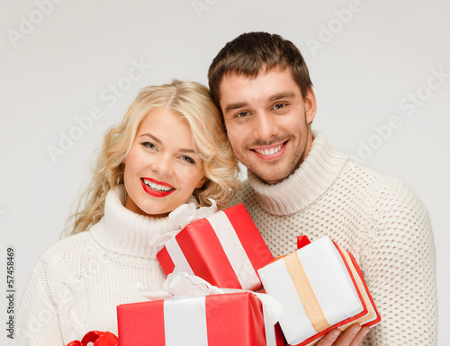 Photo: smiling woman and man with gift box smiling woman and man with gift box