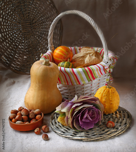 Photo: Basket with pumpkins and hazelnuts Basket with pumpkins and hazelnuts