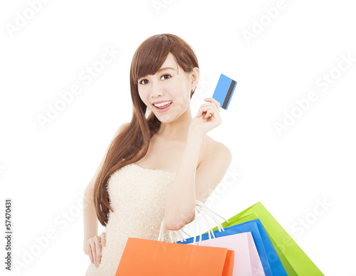 Photo: happy woman with credit card and shopping bags happy woman with credit card and shopping bags