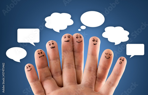 Photo: Happy group of finger smileys with social chat sign and speech b Happy group of finger smileys with social chat sign and speech b