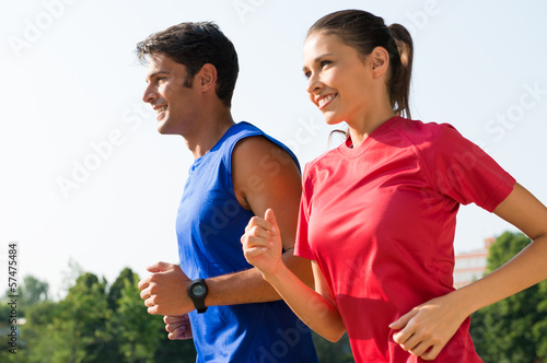 Photo: Happy Couple Jogging Outdoor Happy Couple Jogging Outdoor