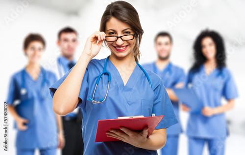 Photo: Doctor in front of her team Doctor in front of her team
